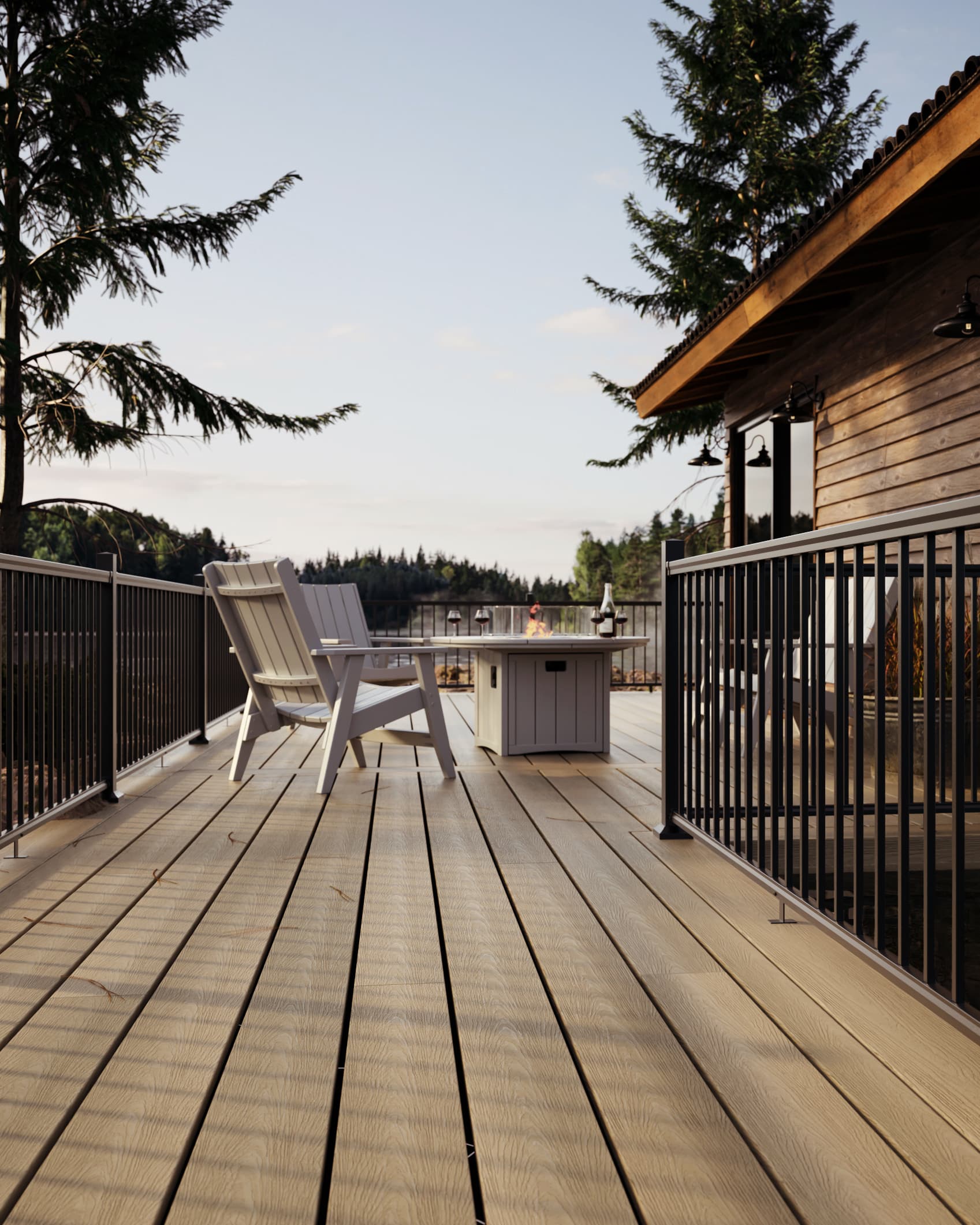 Patio en composite pâle au bord de l’eau avec rampes en aluminium noir, chaises Adirondack et table à feu